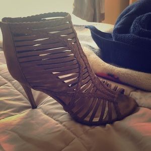 Woman’s brown zip up open toe bootie